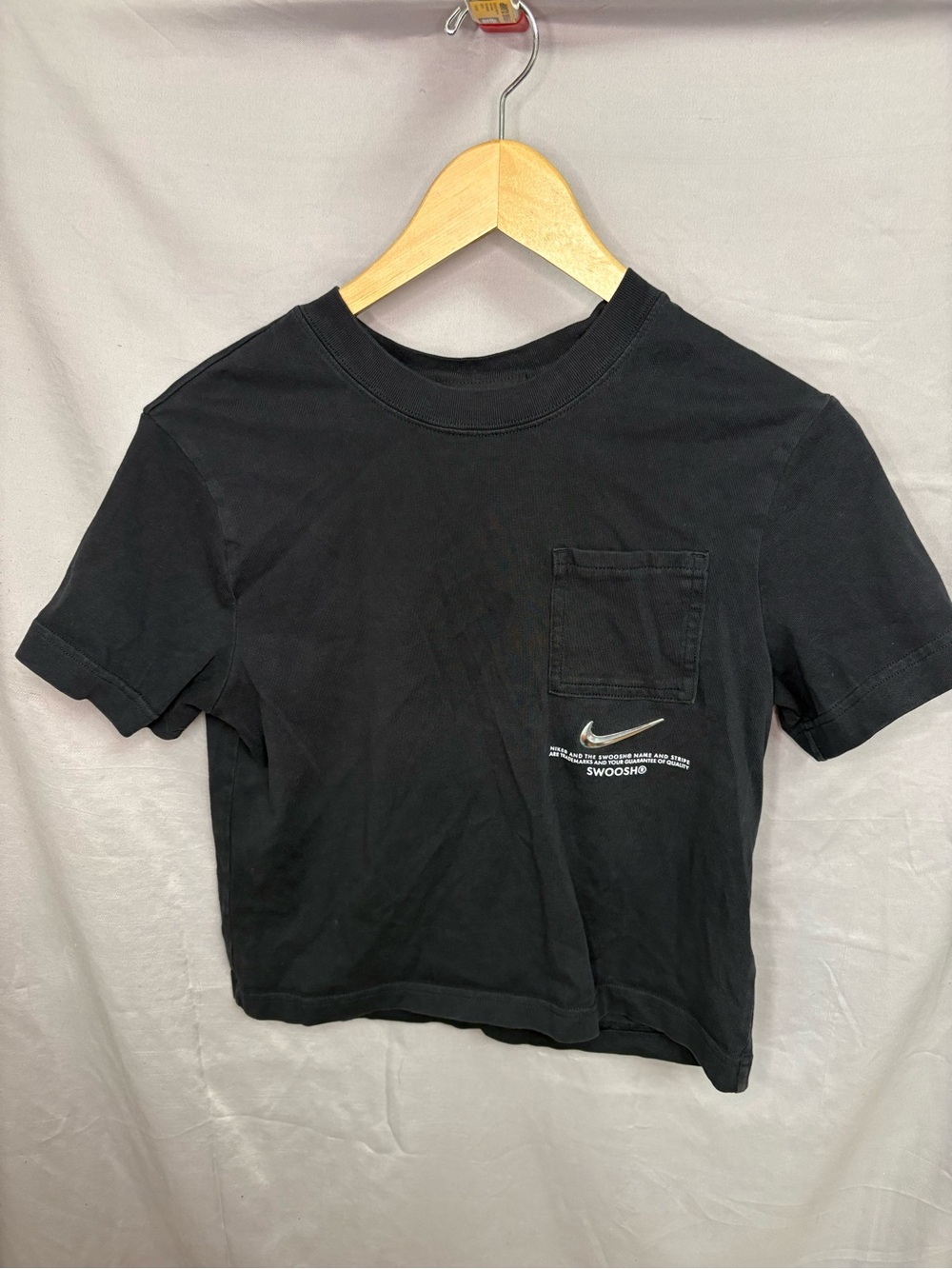 Black Nike crop top with detail on pocket